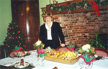 Izzie with xmas food on the table